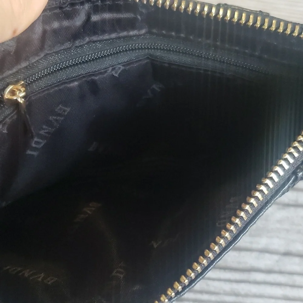 BVNDI black leather upper zip clutch